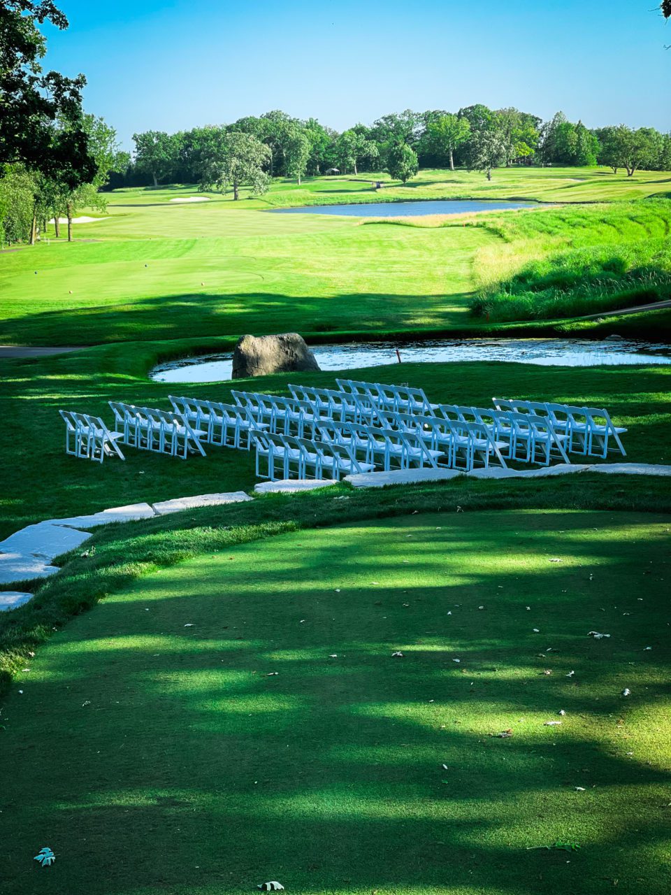 golf course white chairs wedding water beautiful